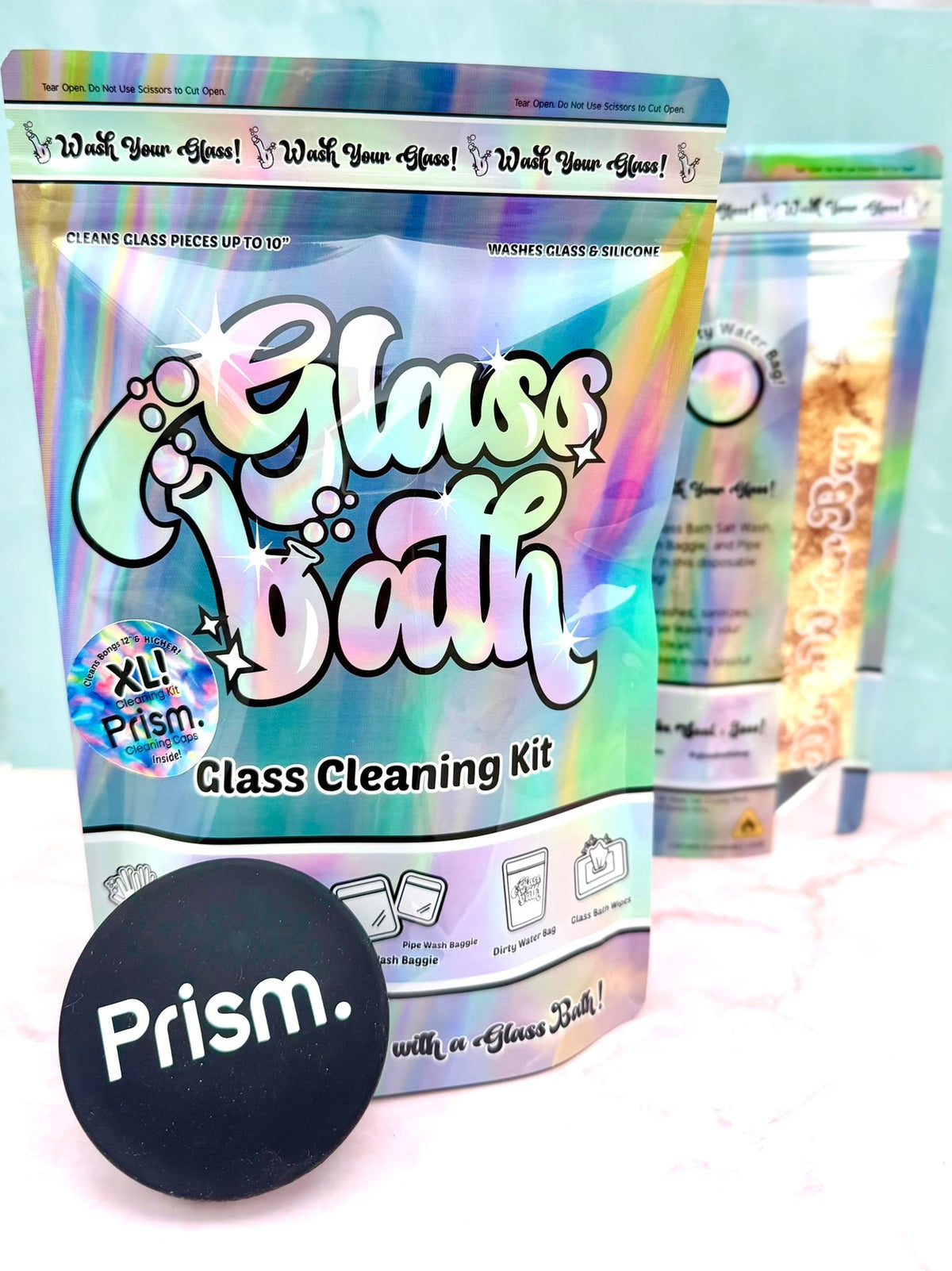 Two Glass Bath cleaning-kit pouches with a black Prism cap, pictured as a bundled-kit example.